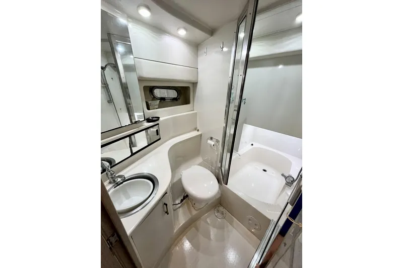  Yacht Photos Pics Bathroom interior of 1996 Bayliner 3988 Motoryacht with sink, toilet, and shower.