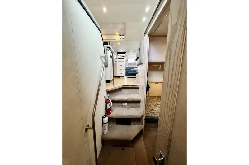  Yacht Photos Pics Interior view of 1996 Bayliner 3988 Motoryacht, featuring stairs and modern cabin design.