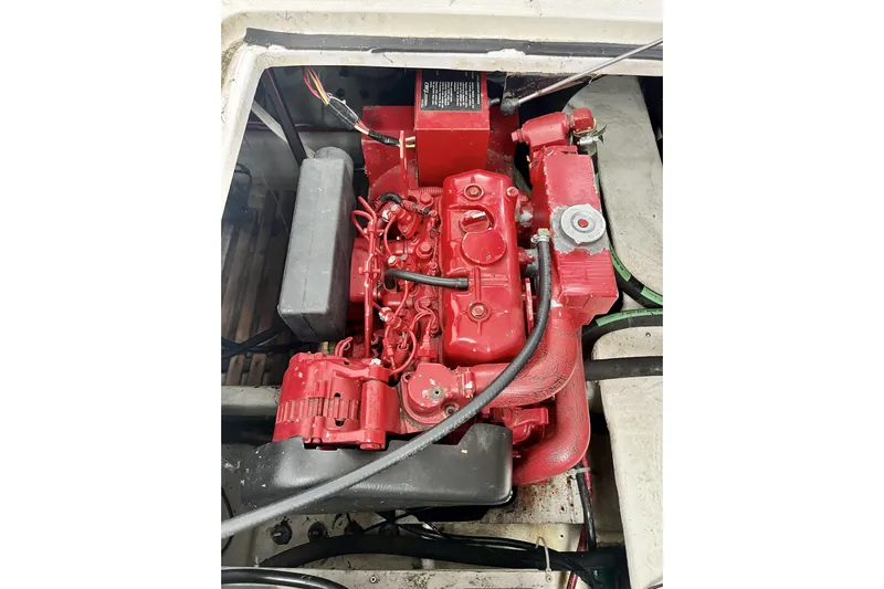  Yacht Photos Pics Red engine of a 1996 Bayliner 3988 Motoryacht, showcasing detailed components.