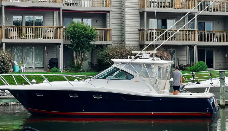  Yacht Photos Pics 2005 Tiara Yachts 3600 Open docked near waterfront apartments.