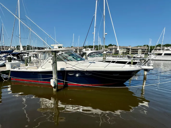  Yacht Photos Pics 2005 Tiara Yachts 3600 Open docked in marina, clear blue sky background.