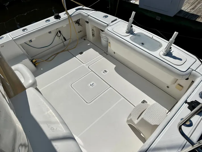  Yacht Photos Pics 2005 Tiara Yachts 3600 Open boat deck with fishing rod holders and storage compartments.