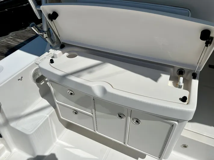  Yacht Photos Pics 2005 Tiara Yachts 3600 Open boat storage compartment with open lid and drawers.