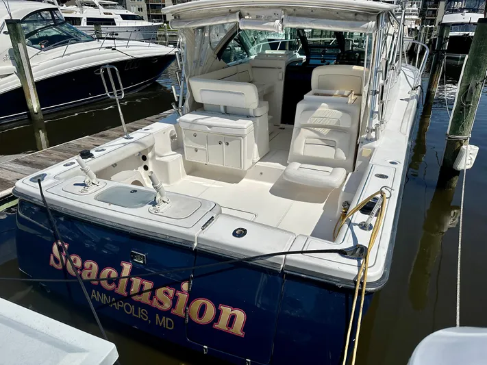  Yacht Photos Pics 2005 Tiara Yachts 3600 Open docked, featuring spacious seating and sleek design.