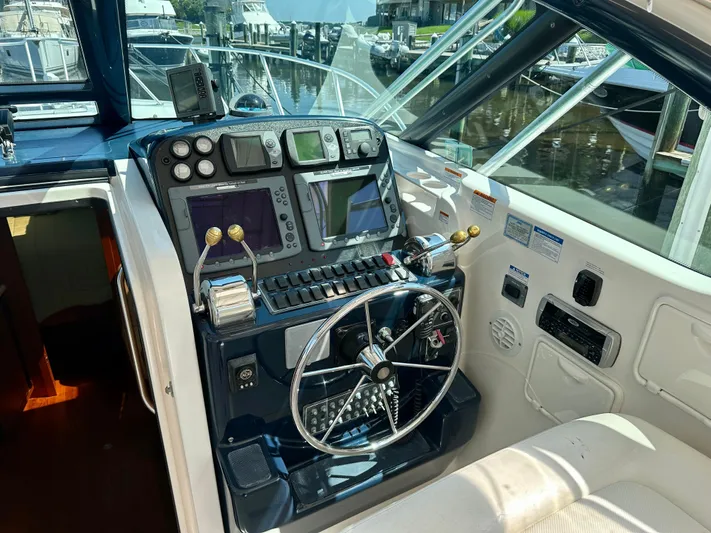  Yacht Photos Pics Helm of 2005 Tiara Yachts 3600 Open with navigation controls and steering wheel.