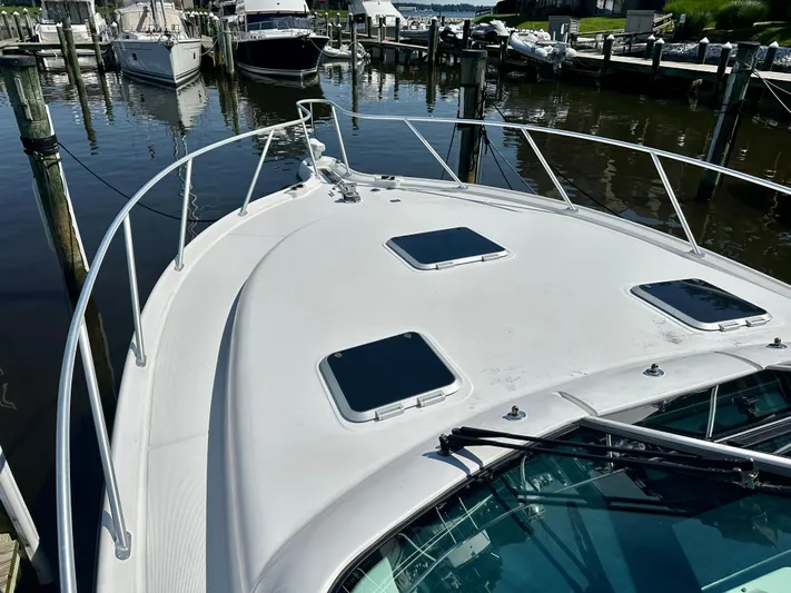  Yacht Photos Pics 2005 Tiara Yachts 3600 Open docked at marina, showcasing sleek deck design.