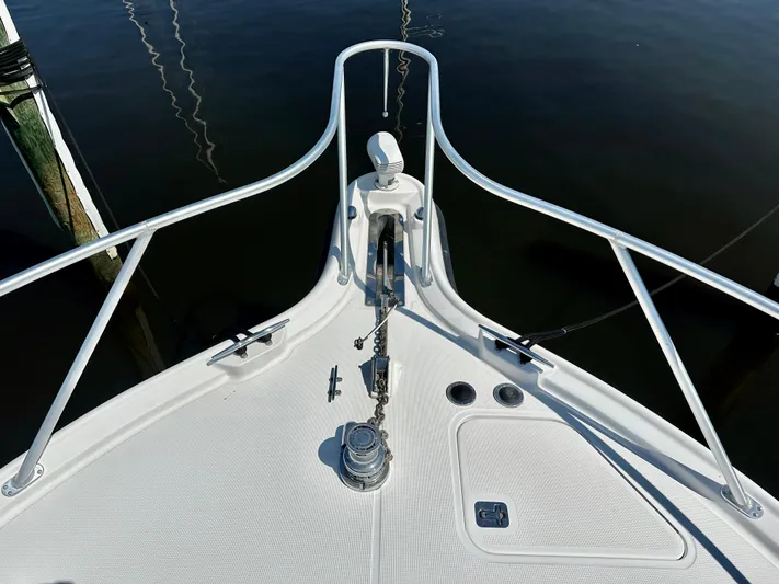  Yacht Photos Pics Bow of 2005 Tiara Yachts 3600 Open, featuring anchor and railing, docked on calm water.