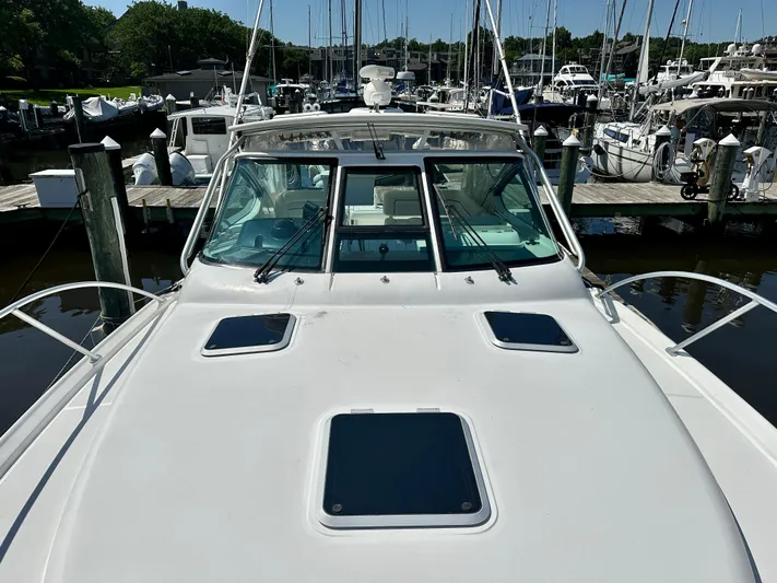  Yacht Photos Pics 2005 Tiara Yachts 3600 Open docked at marina, showcasing sleek design and spacious deck.