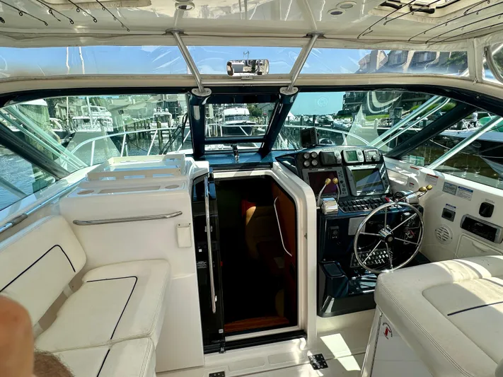  Yacht Photos Pics 2005 Tiara Yachts 3600 Open cockpit with steering wheel and navigation equipment.