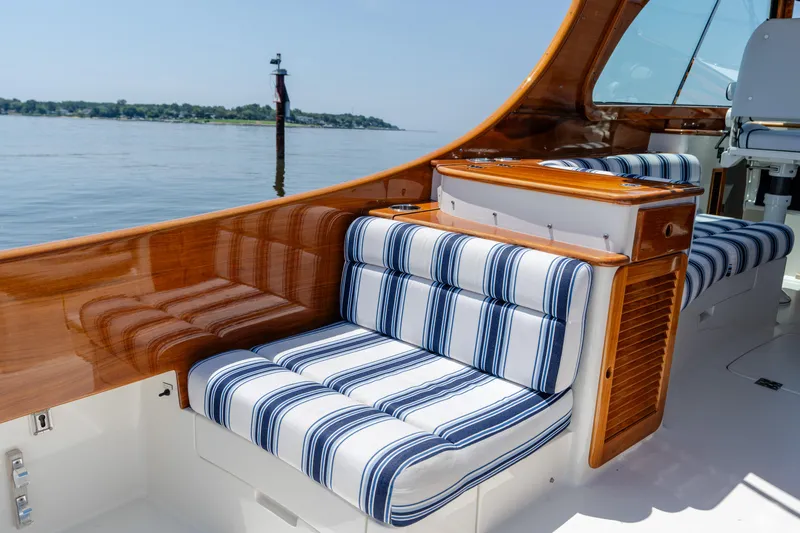 Vivere Yacht Photos Pics 2015 Hinckley Picnic Boat 37 MKIII with striped seating and polished wood interior.