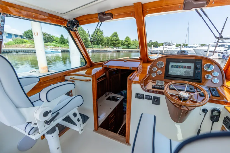 Vivere Yacht Photos Pics Interior of 2015 Hinckley Picnic Boat 37 MKIII with helm, controls, and seating.