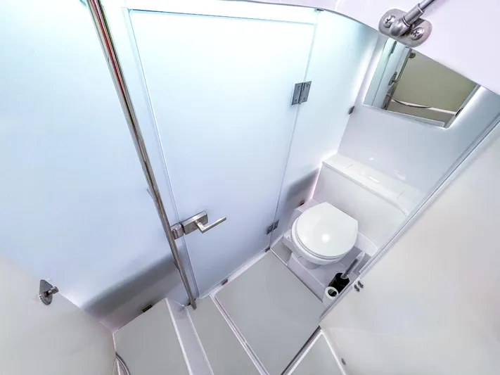  Yacht Photos Pics 2024 Axopar 37 Sun Top bathroom with modern design and sleek fixtures.