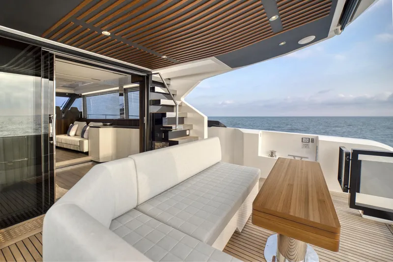  Yacht Photos Pics Luxury 2024 Astondoa AS5 yacht with modern outdoor seating and ocean view.