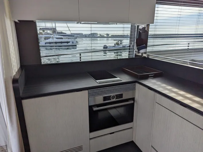  Yacht Photos Pics Modern kitchen in 2024 Astondoa AS5 yacht with waterfront view.