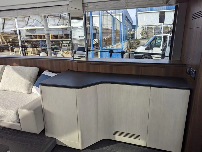  Yacht Photos Pics Interior of 2024 Astondoa AS5 yacht with modern cabinetry and large window.