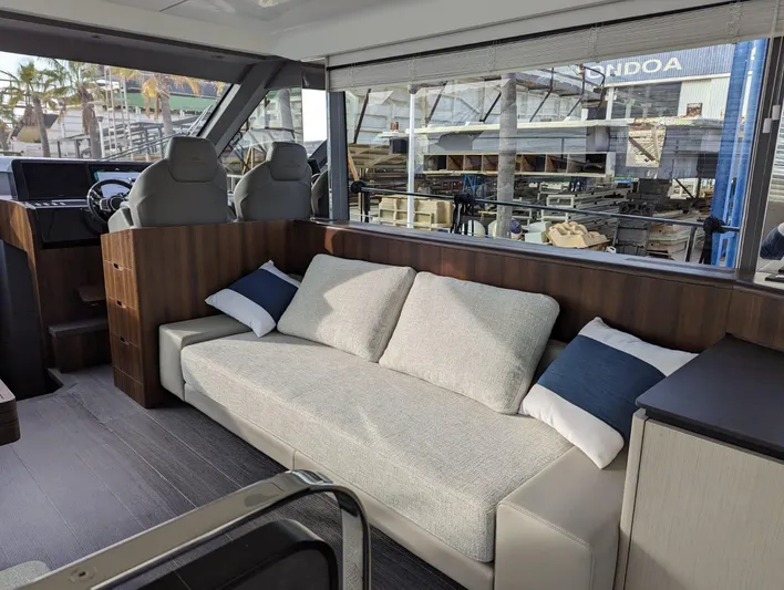  Yacht Photos Pics Interior of 2024 Astondoa AS5 yacht with modern seating and large windows.