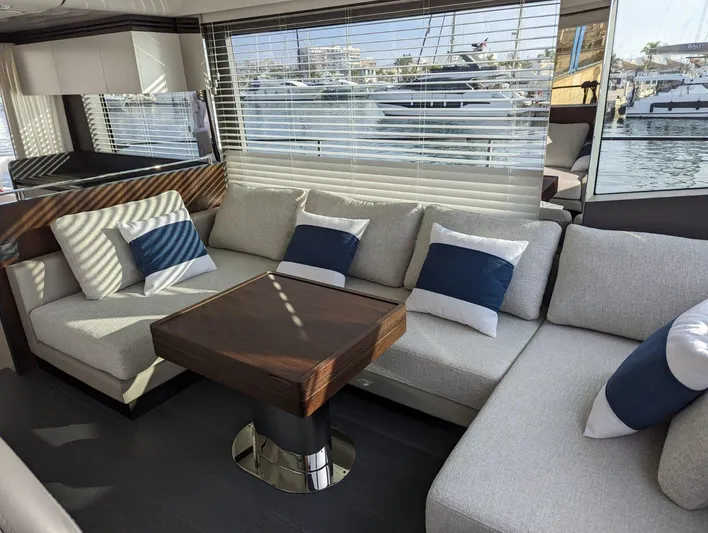  Yacht Photos Pics Luxurious 2024 Astondoa AS5 yacht interior with modern seating and waterfront view.