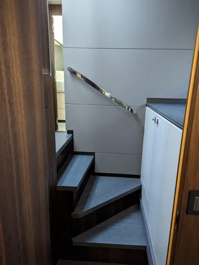  Yacht Photos Pics 2024 Astondoa AS5 yacht interior staircase with modern design and wooden finish.