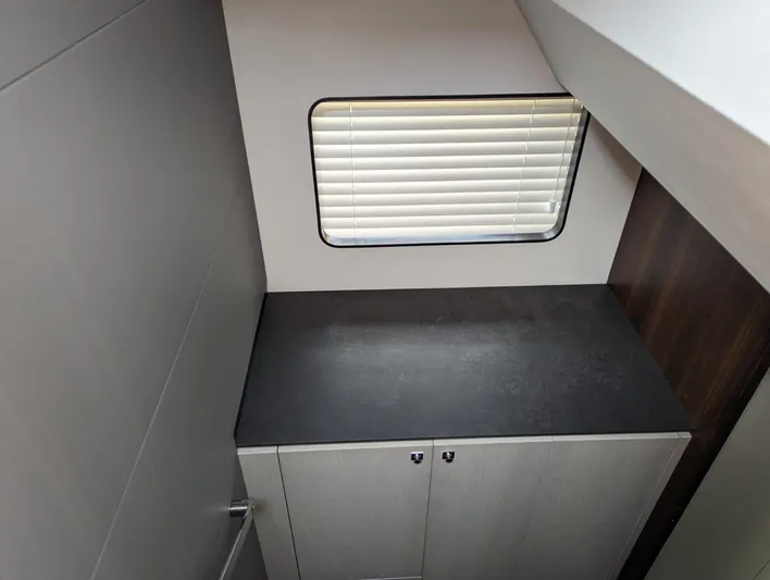  Yacht Photos Pics 2024 Astondoa AS5 interior cabin with window and storage cabinet.