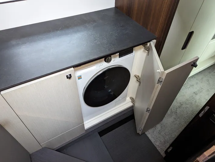  Yacht Photos Pics Laundry area with washer in 2024 Astondoa AS5 yacht.