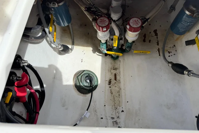  Yacht Photos Pics 2008 Contender 31 Cuddy boat bilge area with valves and wiring.