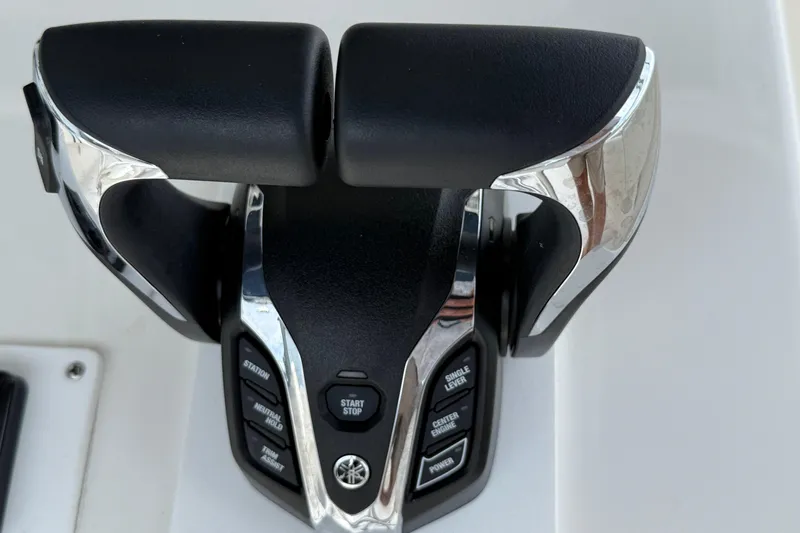  Yacht Photos Pics Throttle controls on a 2008 Contender 31 Cuddy boat, featuring Yamaha engine buttons.