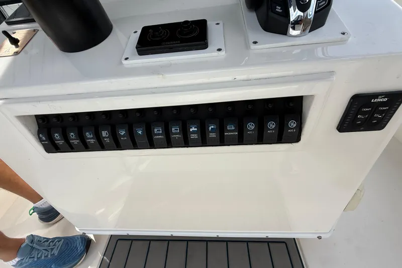  Yacht Photos Pics Control panel of a 2008 Contender 31 Cuddy boat with various switches and controls.