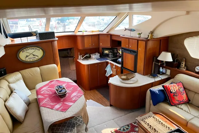  Yacht Photos Pics 2005 Silverton 39 Aft Cabin interior with cozy seating and kitchen area.