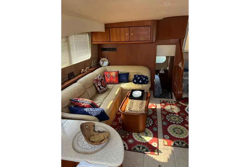  Yacht Photos Pics Luxurious interior of 2005 Silverton 39 Aft Cabin yacht with cozy seating and vibrant decor.