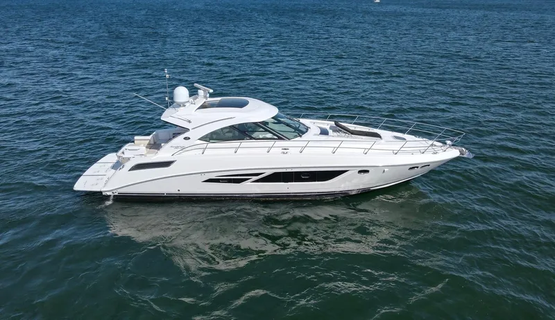Costas Yacht Photos Pics 2015 Sea Ray 540 Sundancer yacht cruising on open water.