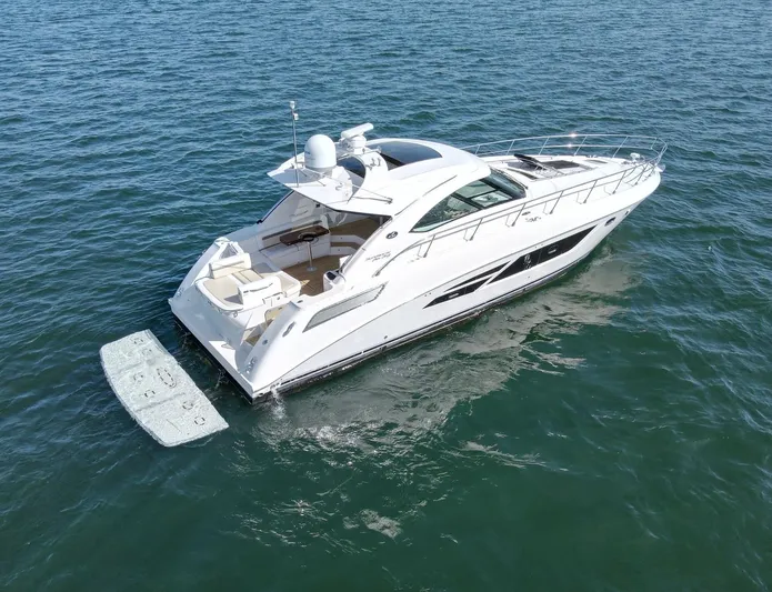 Costas Yacht Photos Pics 2015 Sea Ray 540 Sundancer luxury yacht cruising on open water.