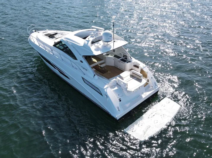 Costas Yacht Photos Pics 2015 Sea Ray 540 Sundancer yacht cruising on open water.