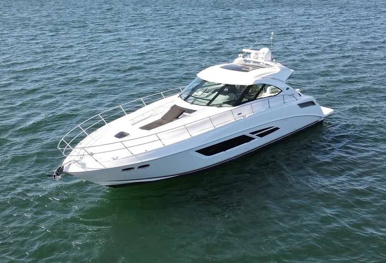 Costas Yacht Photos Pics 2015 Sea Ray 540 Sundancer yacht cruising on open water.