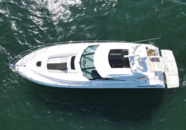 Costas Yacht Photos Pics 2015 Sea Ray 540 Sundancer yacht cruising on open water, aerial view.