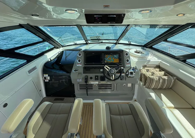 Costas Yacht Photos Pics 2015 Sea Ray 540 Sundancer helm with modern navigation system and luxurious seating.