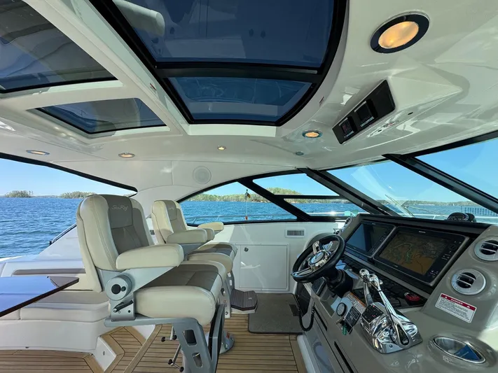 Costas Yacht Photos Pics 2015 Sea Ray 540 Sundancer cockpit with luxurious seating and advanced navigation system.