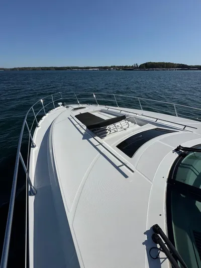 Costas Yacht Photos Pics 2015 Sea Ray 540 Sundancer yacht on open water, sunny day, sleek design.