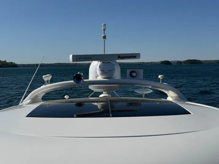 Costas Yacht Photos Pics 2015 Sea Ray 540 Sundancer yacht on open water, featuring advanced navigation equipment.