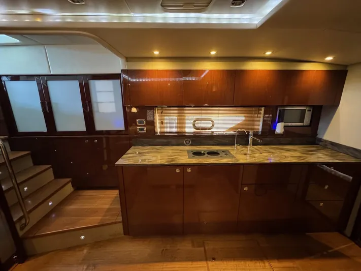 Costas Yacht Photos Pics Luxurious kitchen interior of 2015 Sea Ray 540 Sundancer yacht with modern amenities.