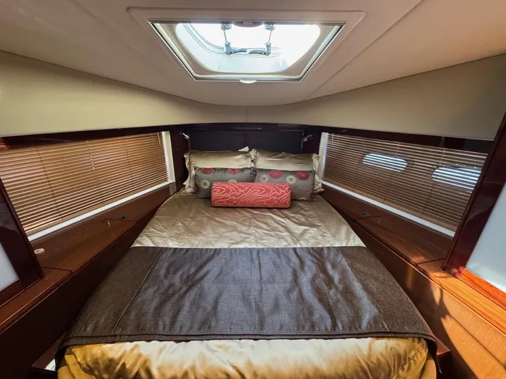 Costas Yacht Photos Pics Luxurious bedroom interior of 2015 Sea Ray 540 Sundancer yacht with skylight and elegant bedding.