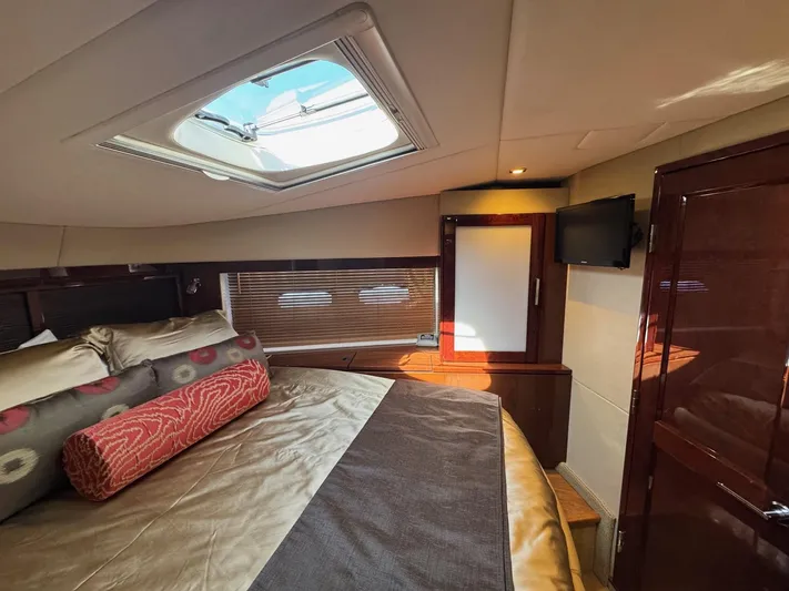 Costas Yacht Photos Pics Luxurious cabin interior of 2015 Sea Ray 540 Sundancer yacht with skylight and TV.