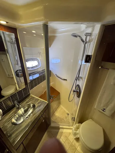 Costas Yacht Photos Pics Luxurious bathroom in 2015 Sea Ray 540 Sundancer yacht with modern fixtures and shower.