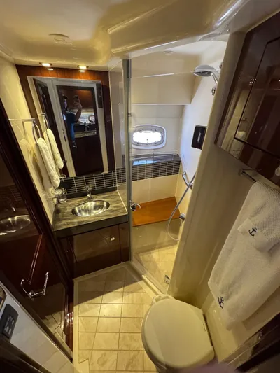Costas Yacht Photos Pics Luxurious bathroom in 2015 Sea Ray 540 Sundancer yacht with modern fixtures and elegant design.