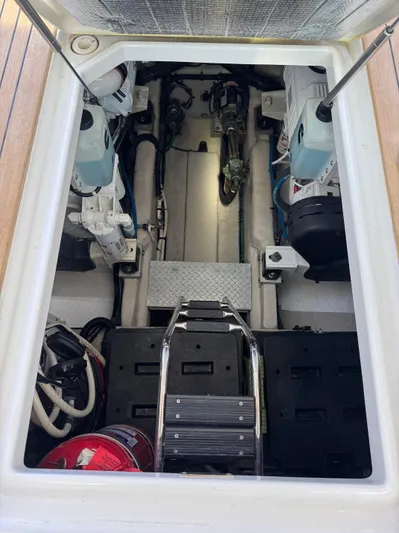 Costas Yacht Photos Pics Engine compartment of a 2015 Sea Ray 540 Sundancer yacht, showcasing mechanical components.