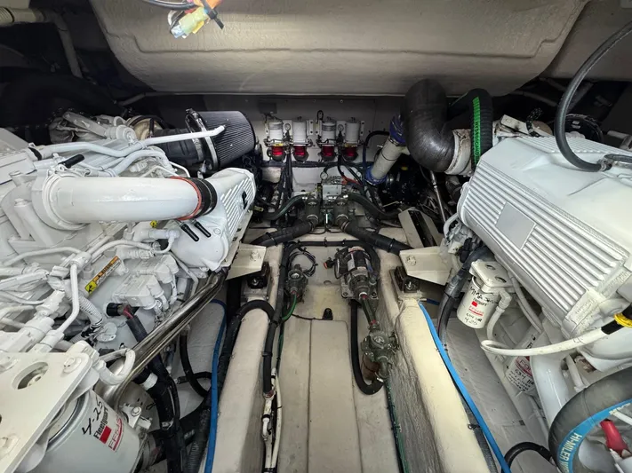 Costas Yacht Photos Pics Engine room of a 2015 Sea Ray 540 Sundancer, showcasing dual engines and mechanical components.