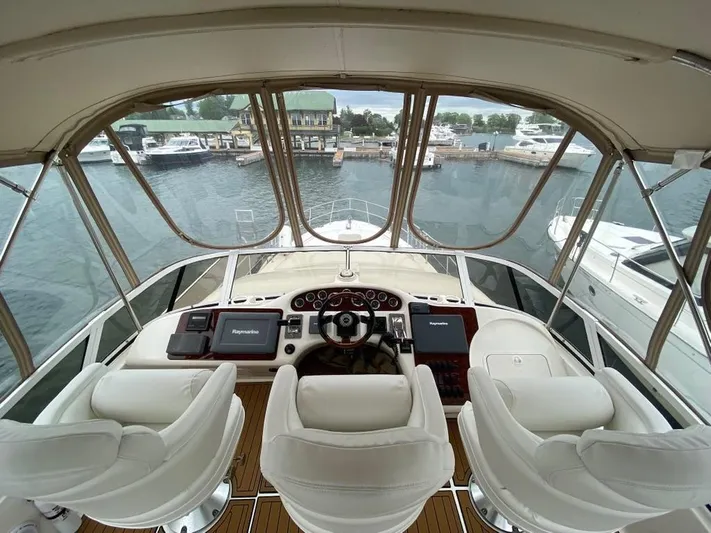  Yacht Photos Pics Cockpit view of 2000 Sea Ray 400 Sedan Bridge yacht at marina.