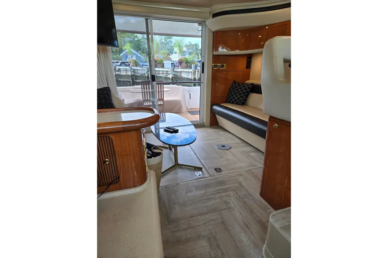  Yacht Photos Pics Interior of 2000 Sea Ray 400 Sedan Bridge yacht, featuring elegant seating and modern decor.