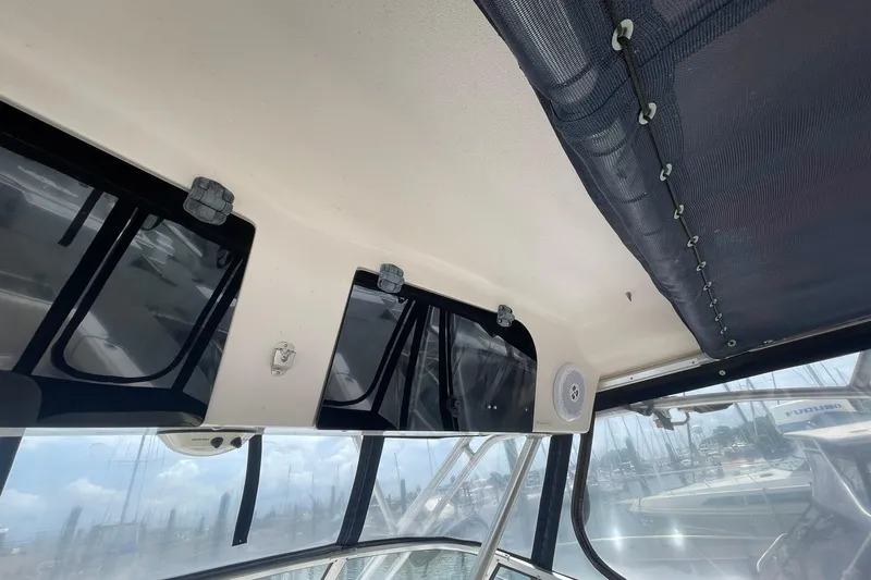  Yacht Photos Pics 2003 Grady-White Express 330 boat interior, featuring windows and a speaker system.