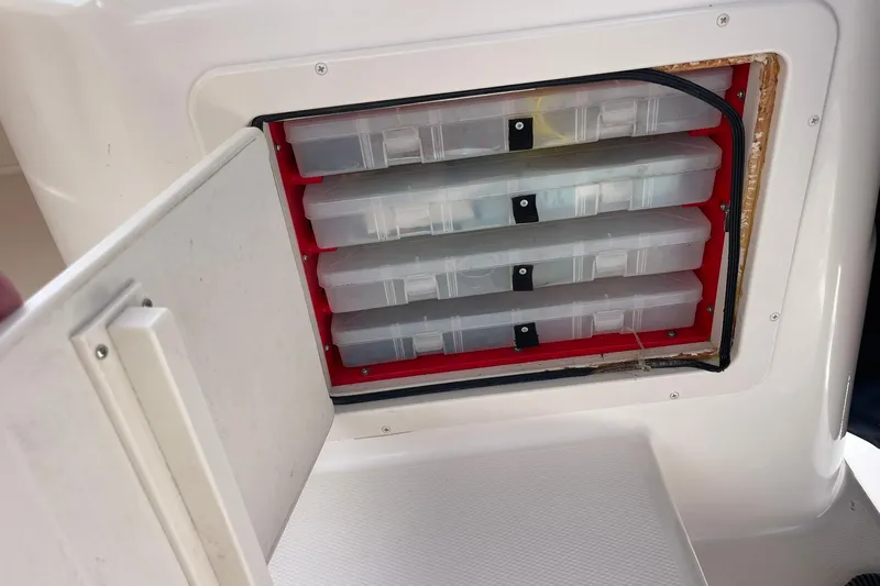  Yacht Photos Pics Storage compartment with tackle boxes on a 2003 Grady-White Express 330 boat.