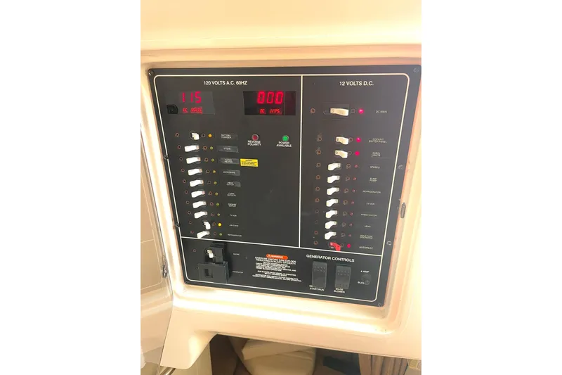  Yacht Photos Pics Electrical control panel on 2003 Grady-White Express 330 boat, displaying voltage and switches.